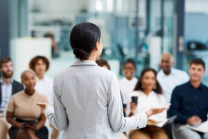 A speaker talks to a attentive room